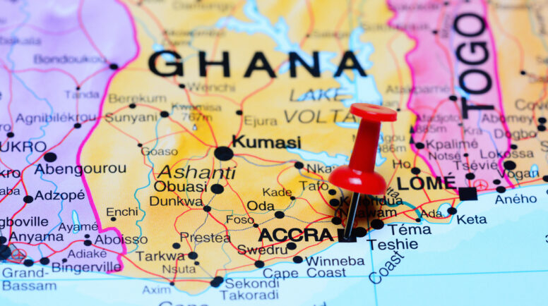 Photo of pinned Accra on a map of Africa. May be used as illustration for traveling theme.